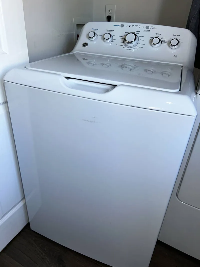 Washer repair job by Quick Repair Co