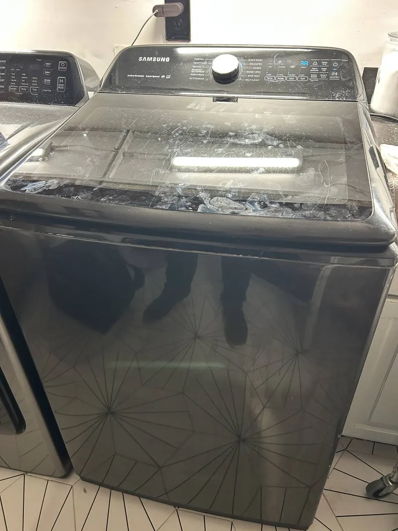 Washer repair job by Quick Repair Co