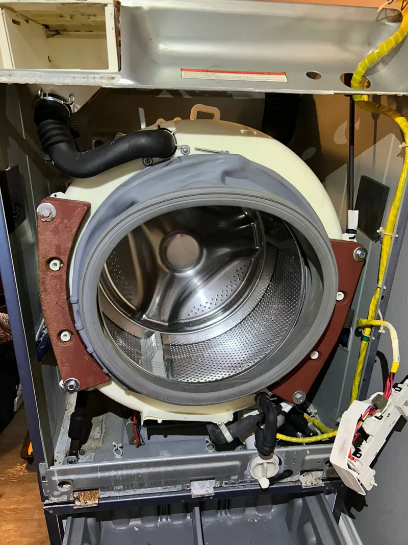 Washer repair job by Quick Repair Co
