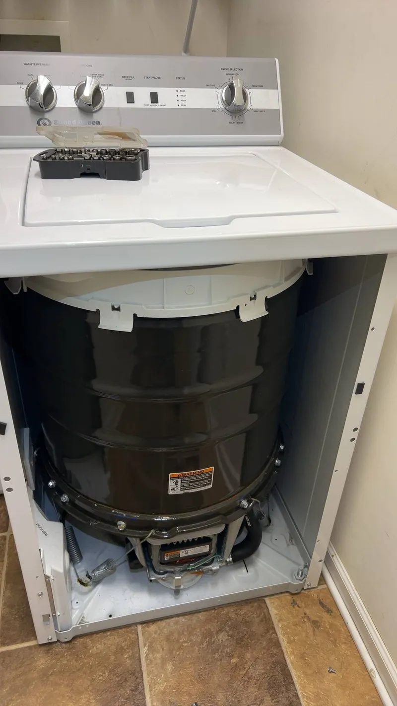 Washer repair job by Quick Repair Co